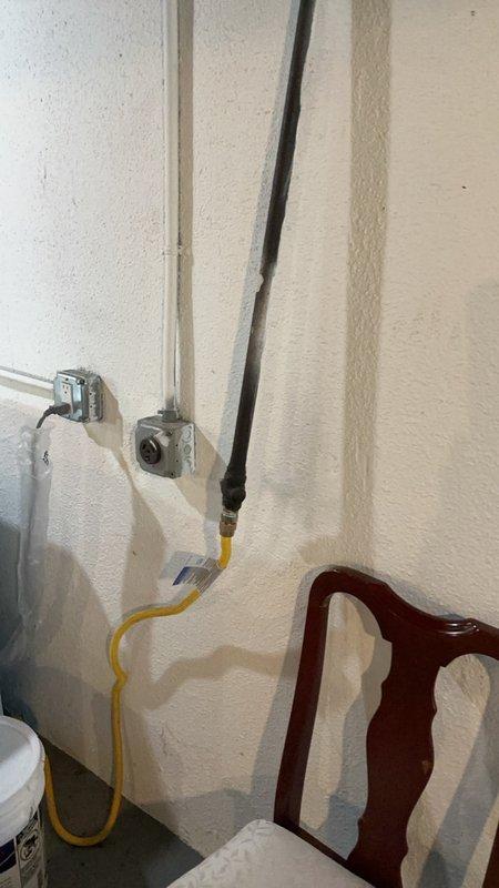 Responded to gas leak service call at rental property where utility company had previously identified and flagged potential leak points in connected piping. Conducted thorough inspection of basement mechanical area, examining gas piping connections, HVAC equipment interfaces, and associated utility lines in unfinished space with exposed ceiling joists and ductwork. Documented conditions with photographic evidence showing pipe routing, wall-mounted cable runs, and mechanical room components including metal ductwork and flexible duct installations for property owner review and verification of flagged locations.