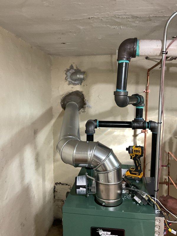 Completed two-day boiler installation including new unit, thermostat, and garage piping repairs. Installed new boiler system with associated ductwork and PVC venting configuration, connected copper supply lines, and repaired damaged piping in garage area. Mechanical and electrical permits were obtained, and all reconnections were completed per code requirements.