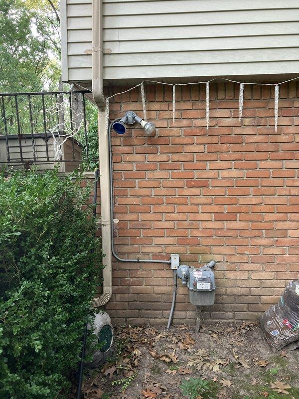 Conducted on-site evaluation for new whole home generator installation at residential property. Assessed existing electrical service infrastructure including 150-amp main service disconnect and utility meter location on exterior brick wall. Documented current electrical panel configuration, gas meter proximity, and available installation space along building exterior. Evaluated site conditions including landscaping clearances, access requirements, and proper positioning for generator placement in accordance with manufacturer specifications and local code requirements.