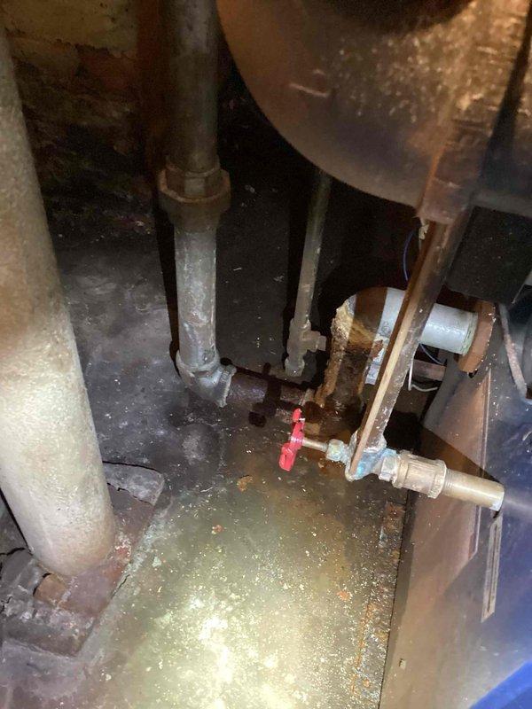 Responded to basement location for steam boiler estimate following reports from plumbing contractor regarding multiple issues and leaking conditions. Performed comprehensive visual inspection of existing steam boiler system, noting advanced age of equipment with significant deterioration of pipe insulation materials, visible corrosion on copper piping components, rust accumulation on various fittings, and evidence of water pooling in drip pan indicating active leakage. Documented condition of all associated piping, valves, and connections throughout the system. Provided detailed estimate for boiler replacement options and necessary remedial work.