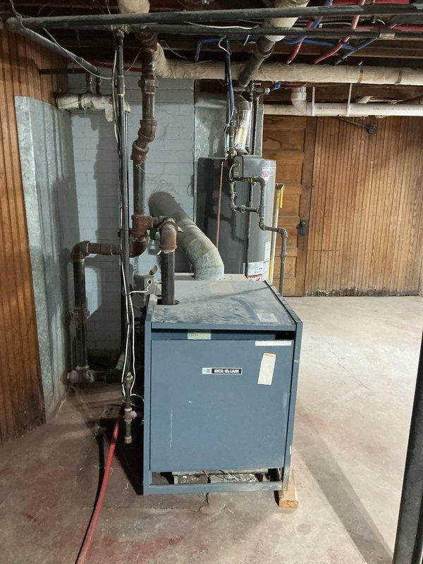 Responded to emergency shutdown of 34-year-old boiler in basement due to high carbon monoxide levels. Performed safety inspection and combustion analysis on boiler serving upper flat unit. Equipment was shut down per safety protocols due to dangerous CO readings. Provided estimate for boiler replacement given age of equipment and unsafe operating conditions.