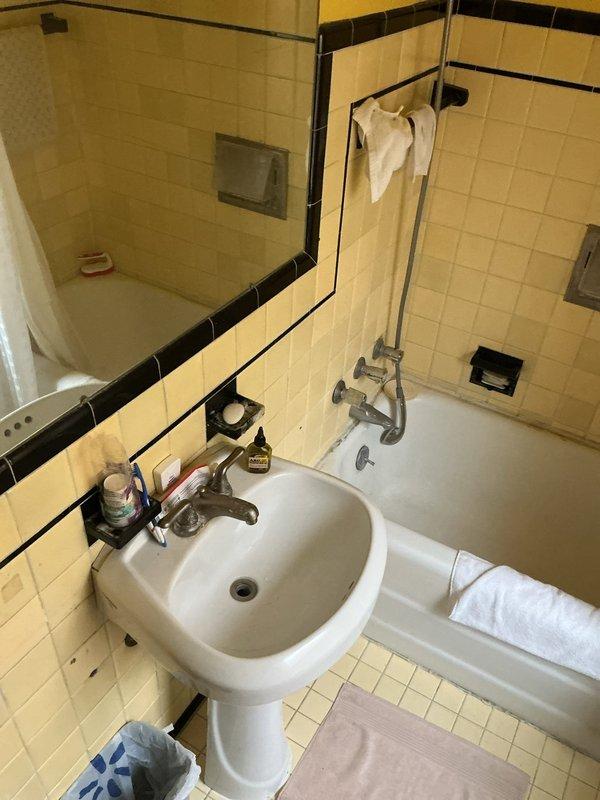 Completed comprehensive whole home plumbing inspection of residential property. Conducted thorough assessment of all visible plumbing fixtures, supply lines, drain systems, and water delivery components throughout the dwelling. Inspected bathroom facilities including pedestal sink with chrome fixtures, bathtub with handheld shower attachment, tile surrounds, and recessed soap niches for proper operation, leaks, water pressure, and drainage functionality. Documented existing conditions through photographic records for homeowner reference and future maintenance planning.