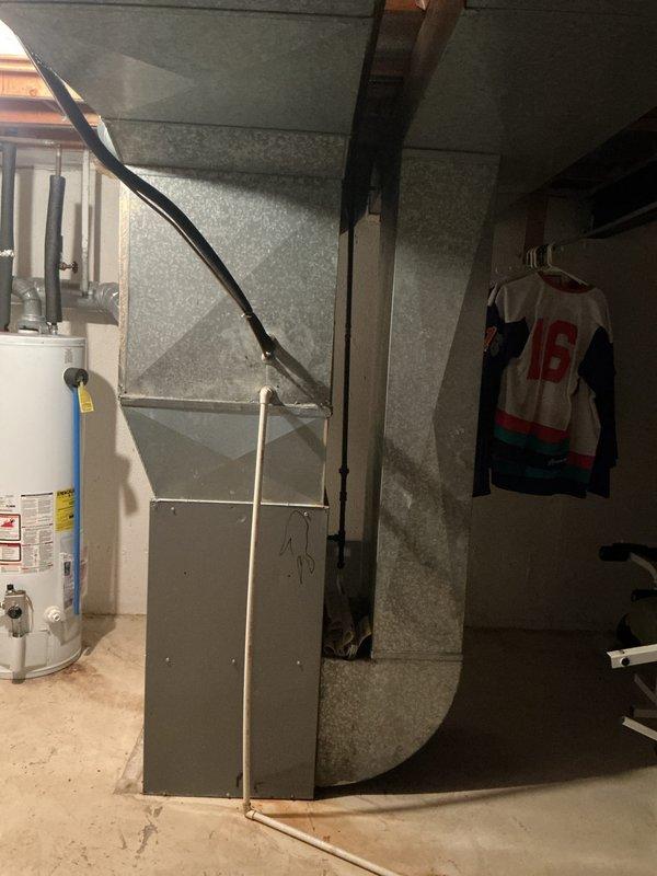 Provided replacement estimate for 30-year-old air conditioning unit and 25-year-old natural gas furnace located in basement. Both systems currently operational but nearing end of service life. Assessed existing ductwork, plenum configuration, and utility connections to determine equipment specifications and installation requirements for complete HVAC system replacement.