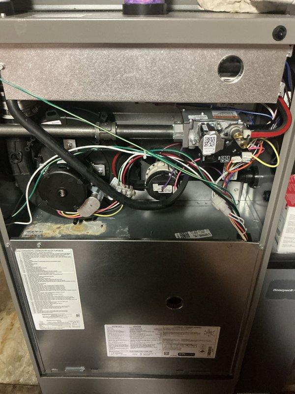Completed comprehensive Gold Furnace Inspection on two basement-located furnace units, both approximately one year old and operational at time of service. Performed thorough examination of internal mechanical and electrical components including gas valve assemblies, blower motors, ignition systems, control boards, and wiring harnesses. Inspected burner assembly, heat exchanger accessibility, and all safety controls. Verified proper gas connections, electrical connections, and component mounting. Documented equipment condition through photographic inspection showing normal operational wear consistent with age of units.