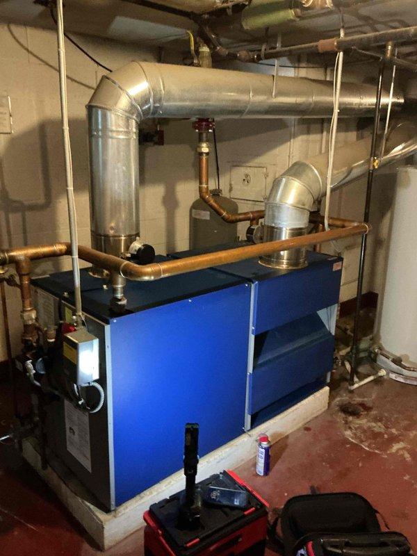 Completed comprehensive Gold Boiler Inspection on basement-located boiler and furnace systems, both exceeding 10 years of age. Performed thorough visual assessment of blue-painted boiler unit, multi-tiered furnace equipment, copper piping, valves, ductwork connections, and all associated HVAC components. All systems inspected for proper operation, safety compliance, and maintenance requirements per Gold service protocol.