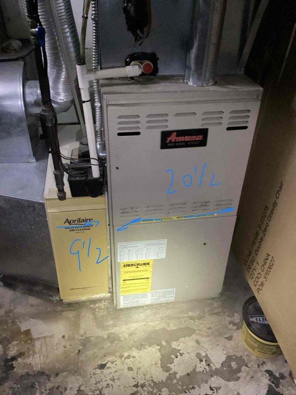 Provided comprehensive estimate for complete HVAC system replacement including furnace and air conditioning unit, plus chimney liner installation for basement-located equipment. Evaluated non-operational 25-year-old Amana natural gas furnace with attached Aprilaire humidifier, noting end-of-service-life condition requiring full replacement. Documented existing installation configuration, ductwork connections, and structural considerations for new equipment installation and proper venting requirements.