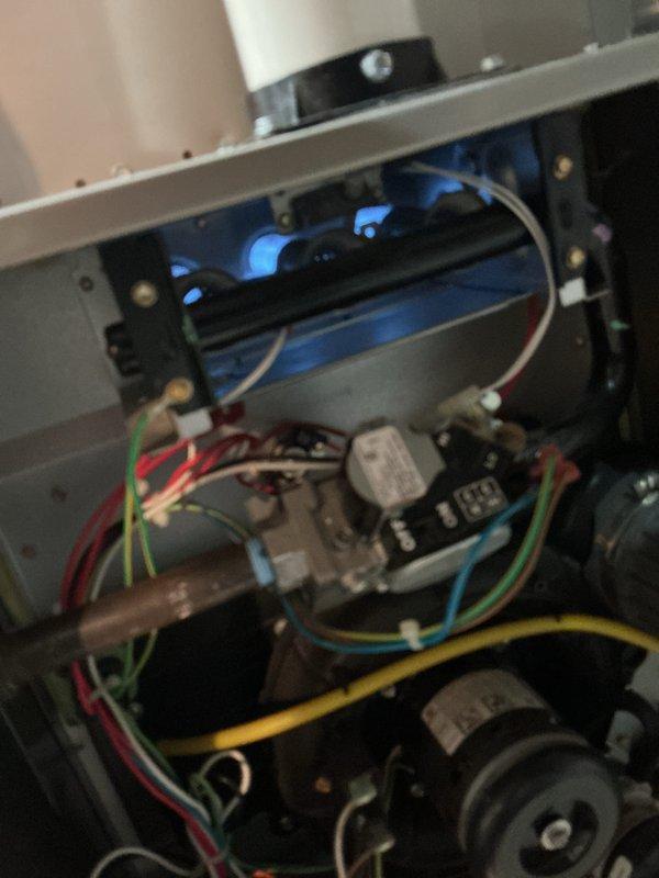 Completed comprehensive NSP furnace inspection on basement-installed unit over 10 years old per customer request for experienced technician. Performed thorough examination of burner assembly, gas valve, control systems, blower motor, and all electrical connections with multicolored wiring harness. Conducted combustion analysis using calibrated diagnostic equipment, recording temperature differentials, CO₂ levels at 4.5%, flue loss at 10.6%, and excess air readings to verify safe and efficient operation of heating system.