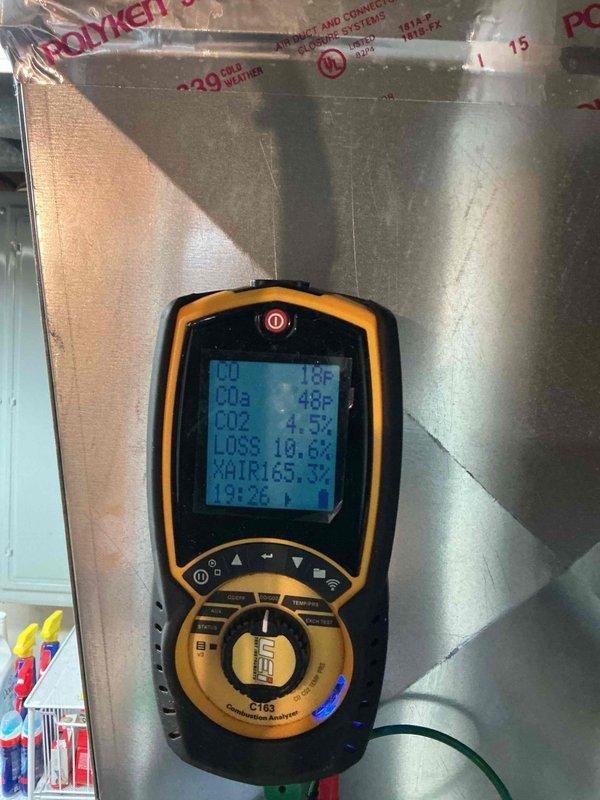 Completed comprehensive NSP furnace inspection on basement-installed unit over 10 years old per customer request for experienced technician. Performed thorough examination of burner assembly, gas valve, control systems, blower motor, and all electrical connections with multicolored wiring harness. Conducted combustion analysis using calibrated diagnostic equipment, recording temperature differentials, CO₂ levels at 4.5%, flue loss at 10.6%, and excess air readings to verify safe and efficient operation of heating system.