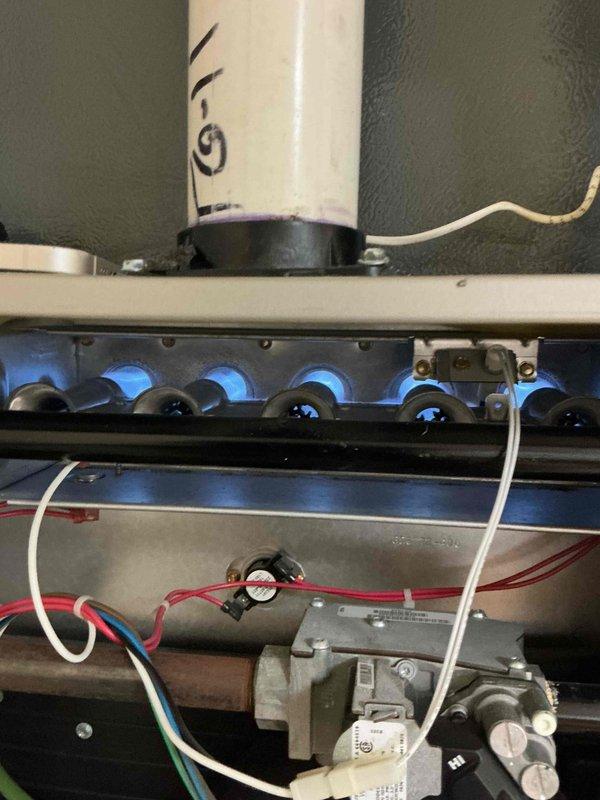 Completed comprehensive tune-up on 7-year-old Bryant gas furnace located in basement. Performed visual inspection of burner assembly, heat exchanger, and gas valve components while unit was operational, confirmed proper ignition sequence and blue flame pattern across all burner ports. Verified all electrical connections, tested safety controls, and ensured exhaust and intake PVC venting systems were properly secured and functioning correctly.