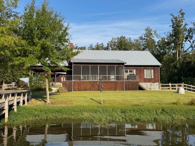 We transformed this cedar siding home with a warm, beautiful stain that highlights the wood's natural character and elevates the home's curb appeal.   We also did a repaint of the shutters, porches and front door.  