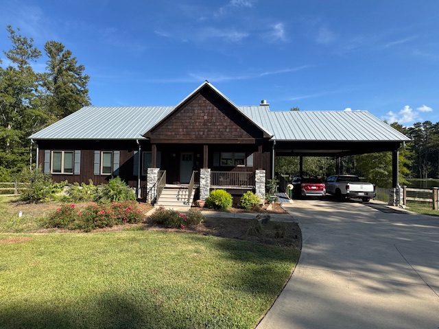 We transformed this cedar siding home with a warm, beautiful stain that highlights the wood's natural character and elevates the home's curb appeal.   We also did a repaint of the shutters, porches and front door.  