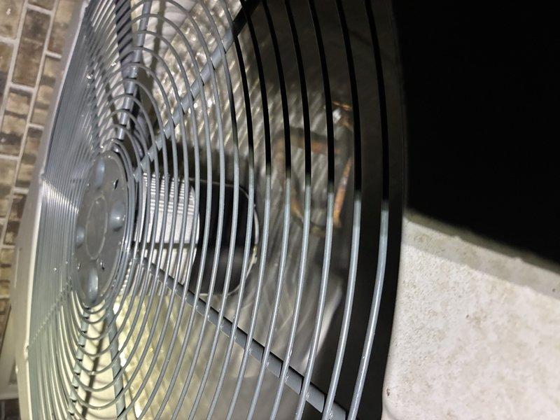Completed seasonal air conditioning service call on Ameristar outdoor condensing unit. Performed comprehensive system inspection including visual assessment of cabinet condition, fan assembly operation, and overall equipment status. Unit exterior and fan grille showed normal wear consistent with outdoor installation. Documented equipment condition through photographic records of condenser cabinet and top-mounted fan assembly for warranty documentation purposes under active 2-year parts and labor and 12-year parts coverage. All components inspected and found operational at time of service.