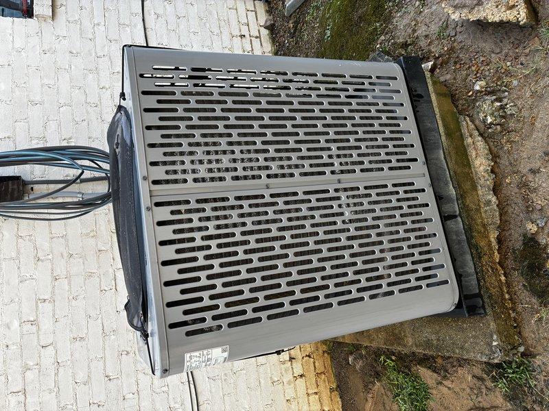 Completed Protection Visit (PPP) on residential air conditioning condenser unit. Performed comprehensive visual inspection of outdoor unit, including examination of top grille ventilation, exterior panels, and electrical connections. Documented condition of compressor assembly, refrigerant lines, and associated copper piping. Noted moisture accumulation on base plate and verified mounting hardware integrity. Unit operational with normal wear patterns observed on metallic surfaces and copper tubing.