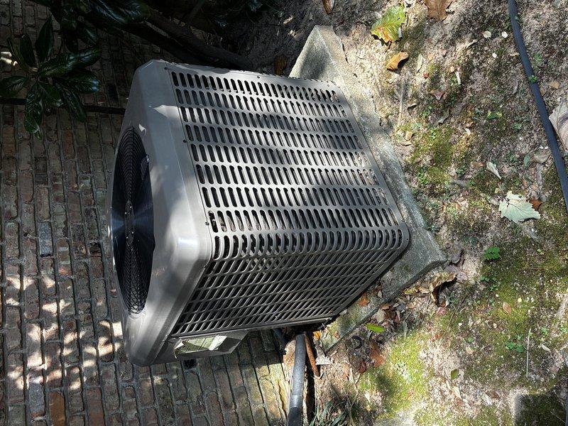 Completed first Protection Plan visit following initial service call. Property has three heating units total, with only one unit under our service agreement. Performed comprehensive inspection and maintenance on the covered heating unit model 1H8A, which is currently under warranty through 10/5. Inspected outdoor condensing unit, verified proper operation of fan assembly, and checked refrigerant lines and electrical connections. Documented equipment condition with photographs showing unit placement on concrete pad with evidence of normal weathering and biological growth on surrounding surfaces. Two additional heating units (models 8H5A and 2H2A) are not covered under current service agreement and were not serviced during this visit.