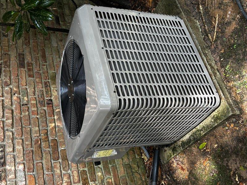 Completed first Protection Plan visit following initial service call. Property has three heating units total, with only one unit under our service agreement. Performed comprehensive inspection and maintenance on the covered heating unit model 1H8A, which is currently under warranty through 10/5. Inspected outdoor condensing unit, verified proper operation of fan assembly, and checked refrigerant lines and electrical connections. Documented equipment condition with photographs showing unit placement on concrete pad with evidence of normal weathering and biological growth on surrounding surfaces. Two additional heating units (models 8H5A and 2H2A) are not covered under current service agreement and were not serviced during this visit.