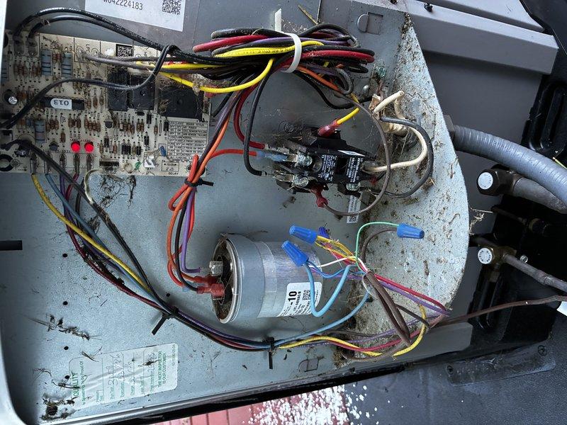 # Service Visit Summary

Completed second service agreement heating maintenance visit on a 4-ton, 4H4A unit not originally installed by our company, which is equipped with UV light system. Accessed unit through top circular hatch and inspected blower motor assembly, heat exchanger coils, and associated ductwork. Examined electrical control board with indicator LEDs, capacitor with proper wire terminations, and relay components within the control compartment. All wiring connections, including multiple wire nuts and bundled conductors, were inspected for security and proper installation. Unit showed normal operational wear with dust accumulation throughout interior components and housing. Documented equipment condition through photographic records of blower assembly, electrical components, and control systems for maintenance history files.