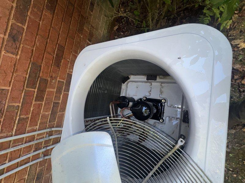 Completed Service Agreement Visit on residential HVAC system. Performed visual inspection of indoor evaporator unit and outdoor condensing unit. Indoor unit inspection revealed significant accumulation of organic debris, leaves, and dirt in the condensate drain pan surrounding the compressor assembly. Outdoor condenser unit inspection showed equipment in functional condition with all components intact and properly assembled. Documented system conditions with photographs for service records.