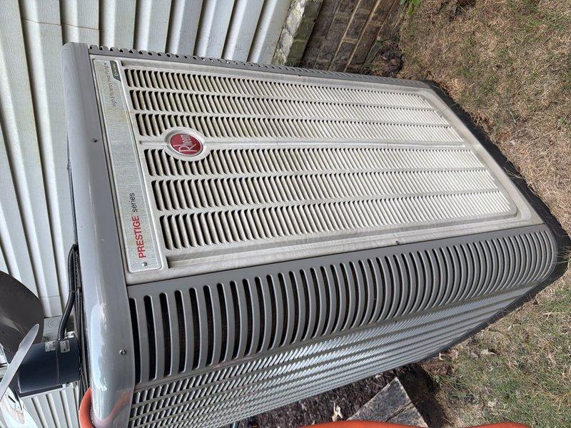 Completed second service agreement heating system inspection on Prestige Series HVAC unit. Performed visual inspection of outdoor condensing unit and indoor air handling components including evaporator coils, refrigerant lines, and drain pan. Noted unit is not under our regular service contract; SENCAP maintains primary service responsibility and has UV light system installed as of November 2025. Documented system condition with photographs showing evaporator coils, copper refrigerant lines, electrical connections, and drain pan with normal condensation present. All accessible components inspected and found operating within normal parameters at time of visit.
