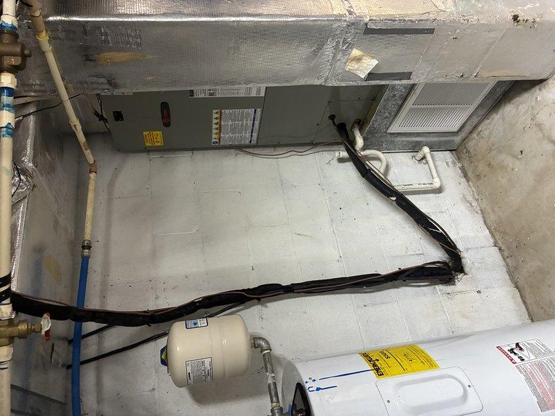 # HVAC System Clean and Check

Performed comprehensive clean and check service on residential HVAC system including air handling unit located in attic space and heating equipment in basement mechanical room. 

Inspected attic-mounted air handler and associated ductwork, verifying proper installation and condition of flexible duct connections. Examined electrical connections, wiring runs along rafters, and junction boxes for safety and code compliance. Assessed blown-in insulation coverage and verified adequate clearances around equipment.

In basement mechanical room, inspected furnace/heating unit with focus on burner assembly, heat exchanger, and ventilation components. Verified proper operation of safety controls and warning labels. Checked water heater and expansion tank for proper installation and function. Examined all visible plumbing connections including copper and PVC piping for leaks or deterioration.

Cleaned and inspected blower assembly, replaced air filter, and verified 