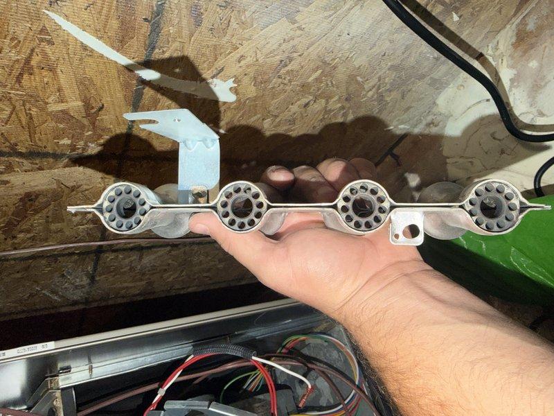 Performed a service agreement inspection on a non-Goodman furnace and removed the burner assembly and flame ignitor for inspection. The burner ports showed soot and carbon residue, and the ignitor had slight discoloration and residue buildup. Prior notes indicate heat exchanger defects, so the unit was evaluated for condition and safe operation, with no UV light or IAQ issues reported in the past.
