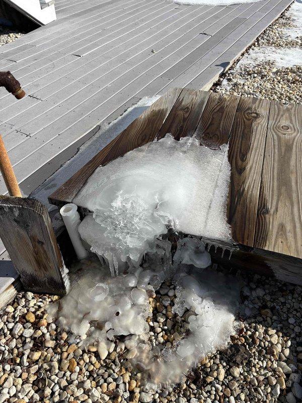 Responded to no-heat service call for geothermal unit displaying E2 error code. Discovered severe ice formation on system components and identified frozen condensate line beneath customer's deck. Thawed ice blockage and restored proper system operation.