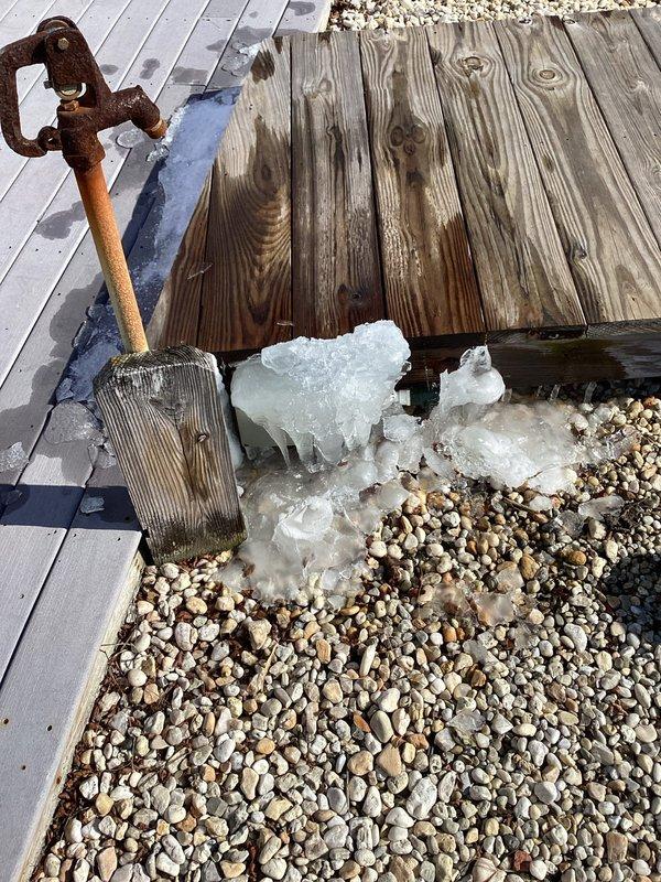 Responded to service call for Matthew Wilson regarding frozen water line. Inspected interior access point revealing PVC plumbing with shut-off valve, and identified outdoor faucet with significant ice formation at base. Performed thawing procedure on frozen pipe section and verified proper water flow restoration.
