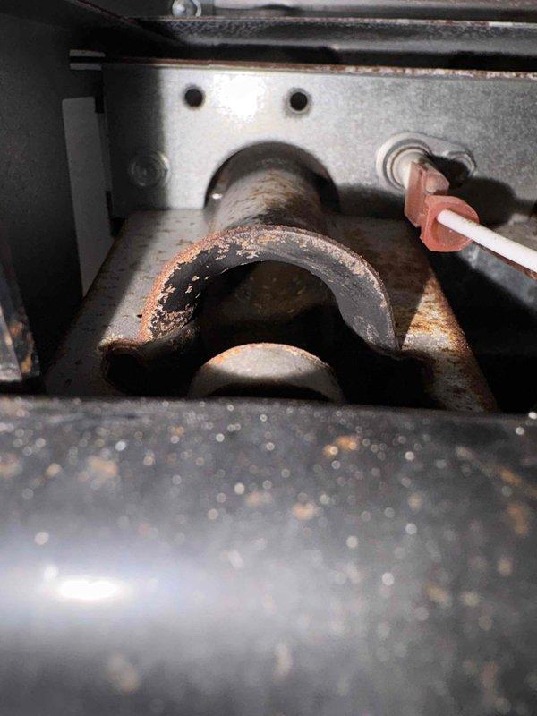 Responded to no-heat service call for 10+ year old system. Inspection revealed severe corrosion and rust damage on critical heat exchanger components. Documented extensive deterioration of metal brackets and housing with photographic evidence. System deemed unsafe for continued operation due to advanced oxidation that presents potential carbon monoxide hazard. Recommended complete system replacement as repair not economically viable given age and condition.