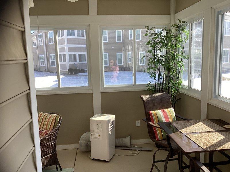 Conducted site evaluation for installation of Mitsubishi ductless mini-split system in client's enclosed sunroom. Assessed current cooling solution (portable AC unit with flexible exhaust) and evaluated space characteristics including window configuration, wall composition, and potential mounting locations. Sunroom features extensive windows on three sides with horizontal siding walls, requiring strategic placement for optimal performance and aesthetics.