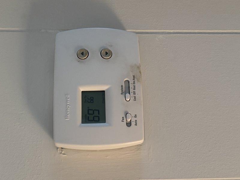 Conducted estimate for replacement of downstairs package unit per owner's request. Existing unit is operational but has worn nameplate making identification difficult. Inspected current installation which is mounted on exterior wall with PVC condensate line. Evaluated existing Honeywell thermostat (currently reading 67°F) for compatibility with potential replacement system.