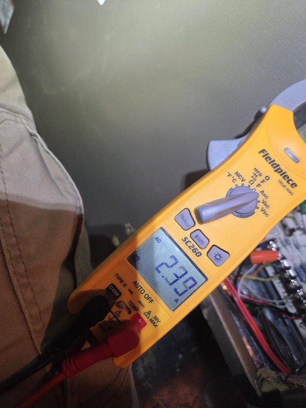 Performed scheduled heating system maintenance and diagnostics. Conducted electrical testing with multimeter showing 2.33 reading on system components and verified temperature readings of -1.5°F with digital thermometer at supply registers.