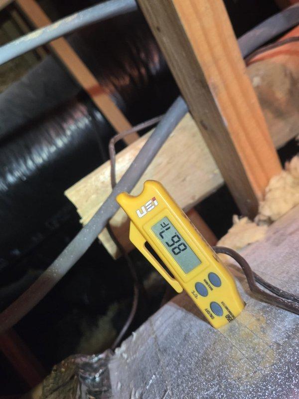 Performed scheduled heating system maintenance and diagnostics. Conducted electrical testing with multimeter showing 2.33 reading on system components and verified temperature readings of -1.5°F with digital thermometer at supply registers.