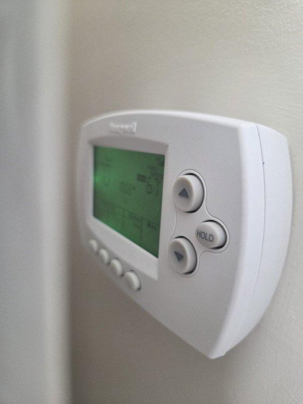 Performed scheduled heating maintenance service as requested by customer. Conducted temperature readings on system components with UEI digital meter, recording high-limit temperature of 608°F. Verified proper operation of Honeywell thermostat and confirmed system is functioning within normal parameters.