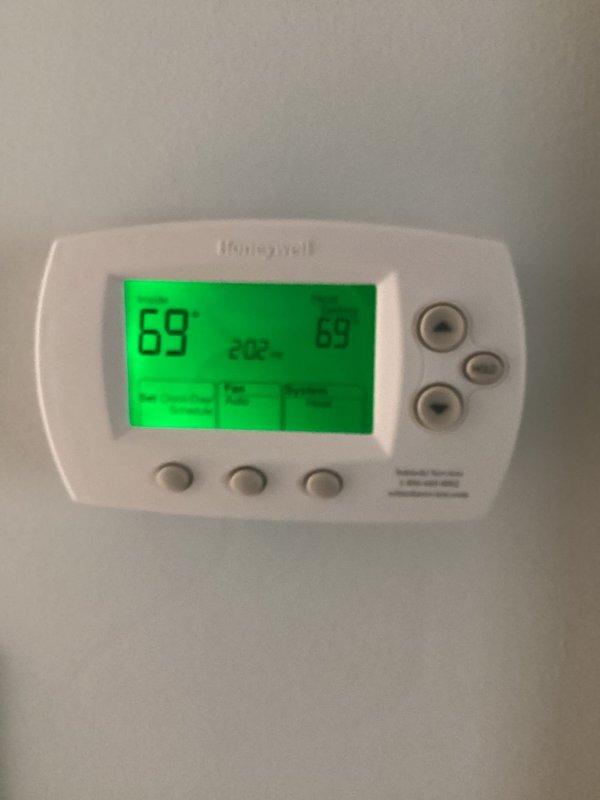 Performed tune-up inspection on one system per customer request. Checked thermostat functionality - confirmed Honeywell digital thermostat operating correctly with proper temperature display (67°F) and heat mode functioning. System heat check completed with all parameters within normal operating ranges.