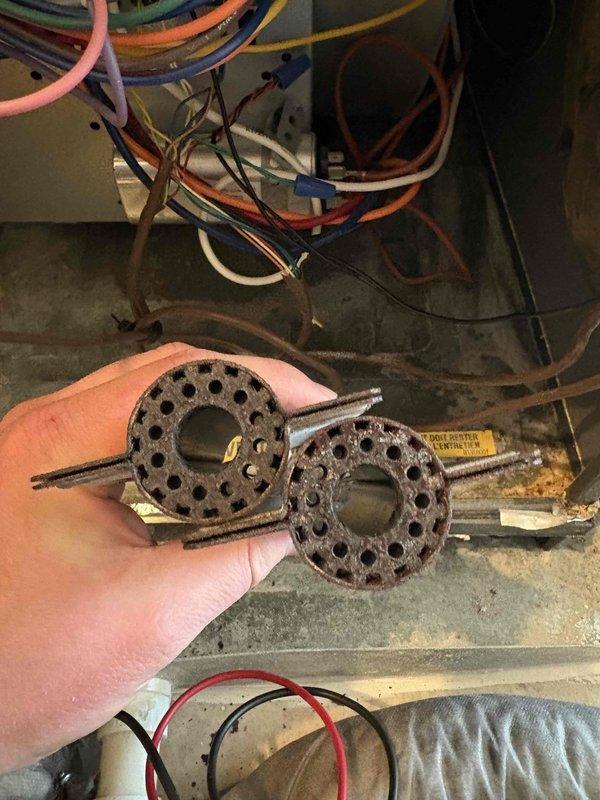 Performed scheduled preventative maintenance on heating system. Discovered severely corroded burners which were replaced. Conducted combustion analysis with Bacharach analyzer showing 90.3% efficiency, 18ppm CO, and normal stack temperatures, confirming system now operating within manufacturer specifications.