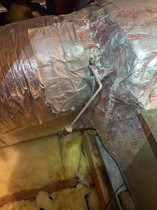 Responded to no heat complaint during extreme cold conditions. Upon inspection, found heat pump system severely iced over. Activated emergency heat mode to allow defrost cycle to complete while inspecting ductwork insulation in attic space. Verified proper system operation after defrost cycle completed and confirmed all connections were secure.