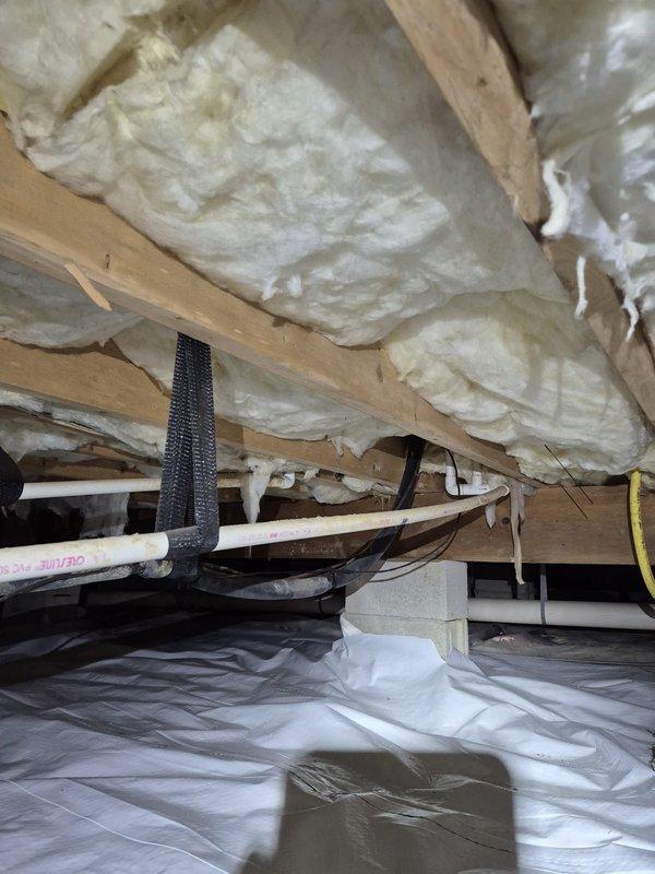 Responded to no heat complaint where condensate pipe was freezing and appeared cracked. Inspection of crawl space revealed mold development on concrete walls due to moisture issues. Repaired damaged section of PVC condensate line and installed proper insulation around the pipe to prevent future freezing.