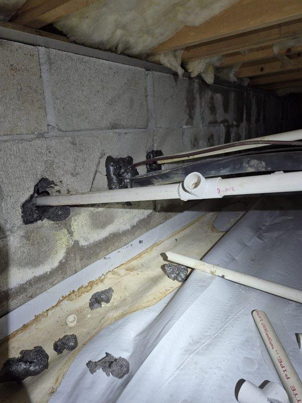 Responded to no heat complaint where condensate pipe was freezing and appeared cracked. Inspection of crawl space revealed mold development on concrete walls due to moisture issues. Repaired damaged section of PVC condensate line and installed proper insulation around the pipe to prevent future freezing.