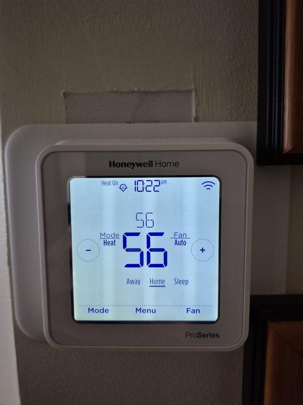 Responded to a no cool call for aging HVAC system. Discovered coupling issue on condensate drain line requiring adhesive. Unable to complete repair due to frozen glue in outdoor closet location. Scheduled return visit to glue coupling and reapply insulation over the connection. Verified thermostat operating in heat mode at 56°F.