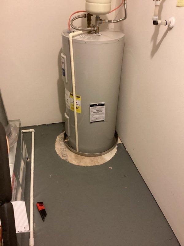 Successfully completed removal and installation of a Bradford White 50-gallon electric medium water heater with expansion tank in utility area. Old unit was properly disposed of and new system was connected to existing plumbing with all necessary valves and fittings, ensuring proper function and compliance with current codes.