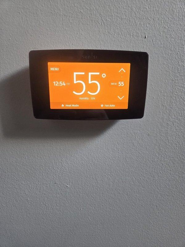 Performed routine heating maintenance visit at property manager's request. Verified thermostat functioning properly, displaying 55°F with 37% humidity in heat mode. Conducted electrical diagnostics with clamp meter, confirming system amperage at 58A within normal operating parameters.
