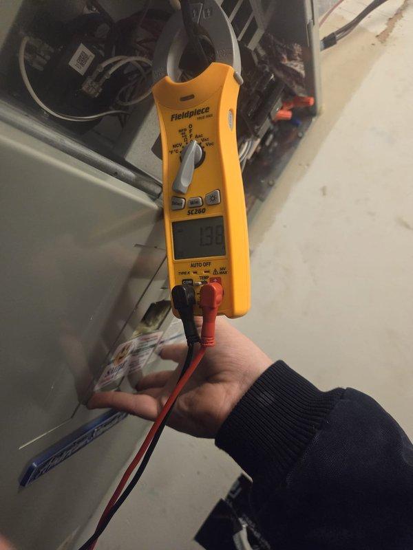 Performed routine heating maintenance visit at property manager's request. Verified thermostat functioning properly, displaying 55°F with 37% humidity in heat mode. Conducted electrical diagnostics with clamp meter, confirming system amperage at 58A within normal operating parameters.