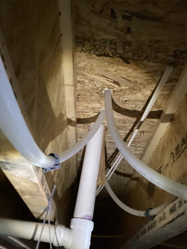 Successfully installed a Moen Mo-Flo system with complete PVC piping infrastructure in the crawl space. Secured drainage and venting components with proper T-junction connections and clean-out access points, ensuring all pipes were properly fastened with zip ties to structural elements for stability and code compliance.