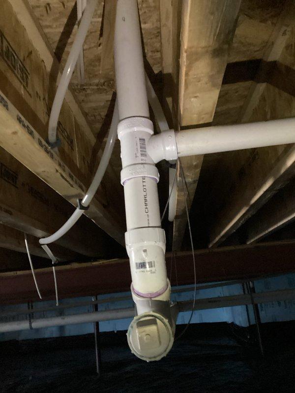 Successfully installed a Moen Mo-Flo system with complete PVC piping infrastructure in the crawl space. Secured drainage and venting components with proper T-junction connections and clean-out access points, ensuring all pipes were properly fastened with zip ties to structural elements for stability and code compliance.