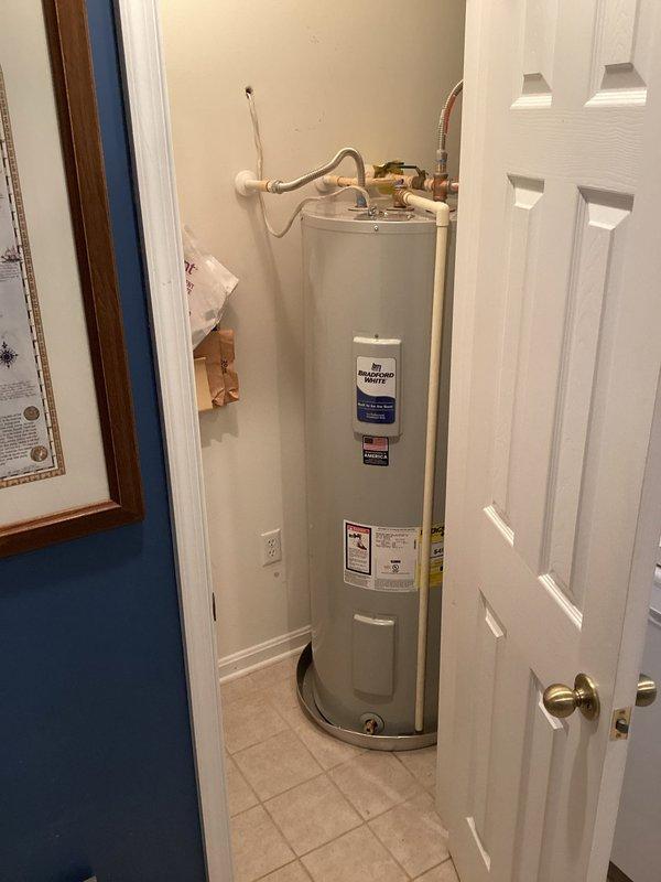 Completed installation of a complete HVAC system including a 2.5 TON heat pump (model 5A6H5030), variable speed fan coil unit (5TEM6B03), and 10KW heater with breaker (BAYHTR1510BRKR). Removed old equipment, installed new components with transition fittings to existing ductwork, performed system flush and refrigerant charge, and set up Honeywell T-6 WiFi thermostat. Additionally, installed a 50-gallon Bradford White electric water heater with drain pan in utility closet.