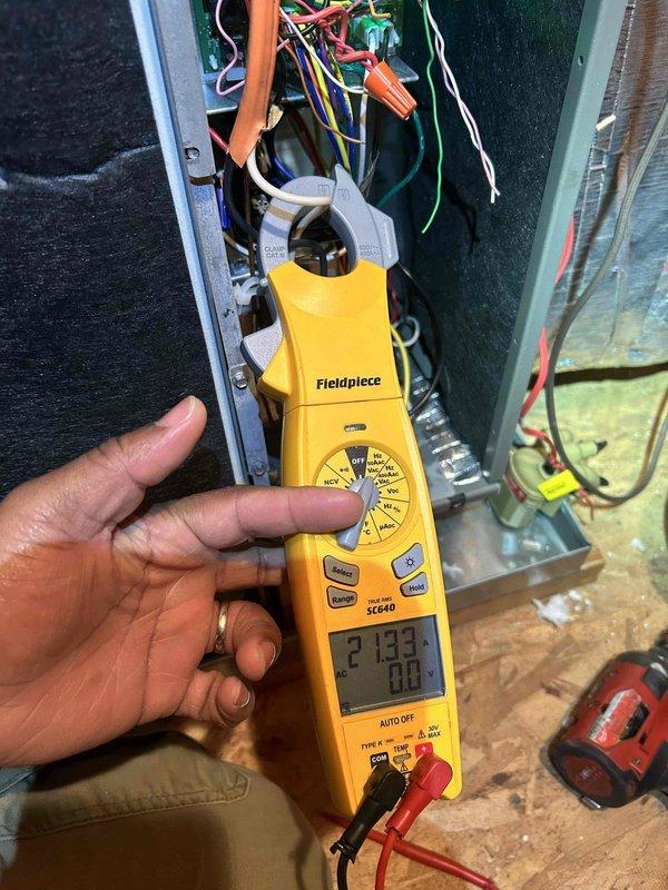 Responded to warranty service call for upstairs HVAC system not functioning properly during morning hours. Diagnostic testing revealed low voltage readings of 27.33V at control board, below minimum operating threshold. Ambient temperature readings showed 69.6°F at insulated ductwork, confirming inadequate heating output. Replaced faulty transformer and restored proper voltage levels, returning system to normal operation.