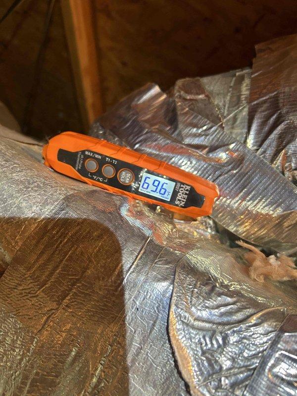 Responded to warranty service call for upstairs HVAC system not functioning properly during morning hours. Diagnostic testing revealed low voltage readings of 27.33V at control board, below minimum operating threshold. Ambient temperature readings showed 69.6°F at insulated ductwork, confirming inadequate heating output. Replaced faulty transformer and restored proper voltage levels, returning system to normal operation.