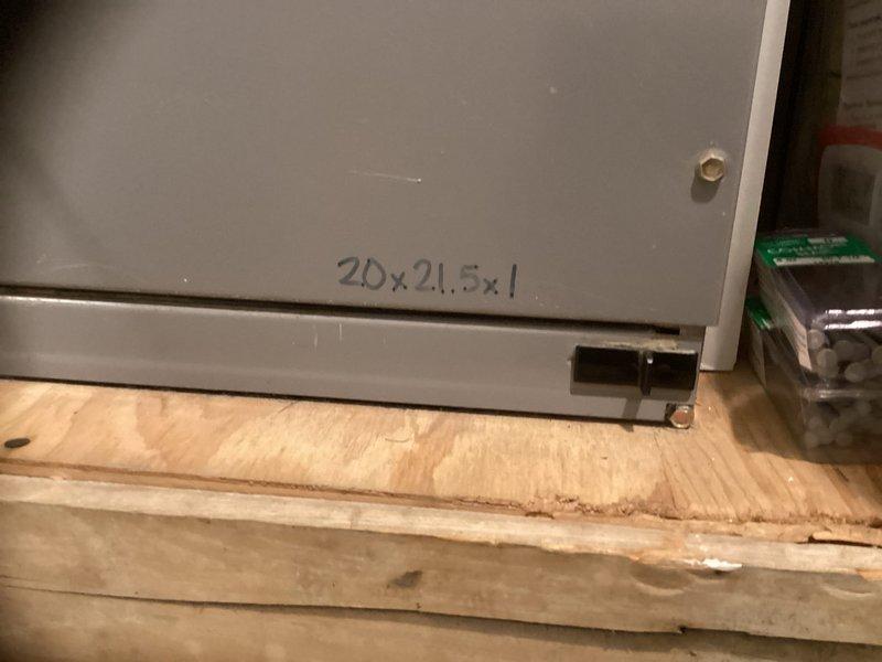 Responded to call from property manager regarding R22 system with completely frozen outdoor unit. Inspected existing Carrier system and documented dimensions (20x21.5x1) for replacement components. Recommended full system replacement due to age of equipment, R22 refrigerant phase-out, and extensive ice formation indicating potential compressor or refrigerant circulation issues.