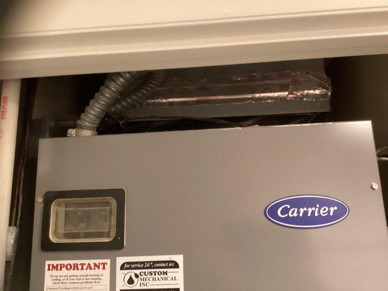 Responded to call from property manager regarding R22 system with completely frozen outdoor unit. Inspected existing Carrier system and documented dimensions (20x21.5x1) for replacement components. Recommended full system replacement due to age of equipment, R22 refrigerant phase-out, and extensive ice formation indicating potential compressor or refrigerant circulation issues.