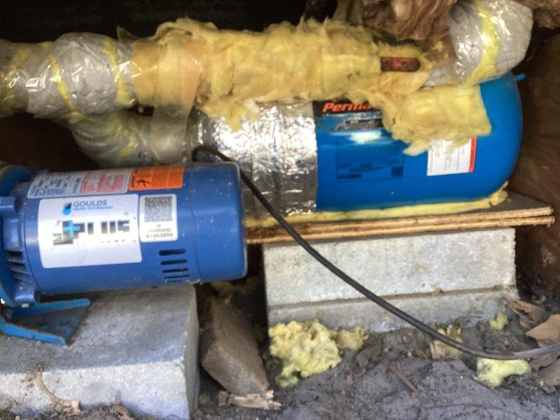 Responded to customer call regarding no water pressure. Diagnosed pump motor assembly that was stuck in closed position. Replaced the faulty Goulds water pump assembly with a new unit, restoring normal water pressure to the home. System now functioning properly with the J-PLUS pump correctly installed on the concrete block base.