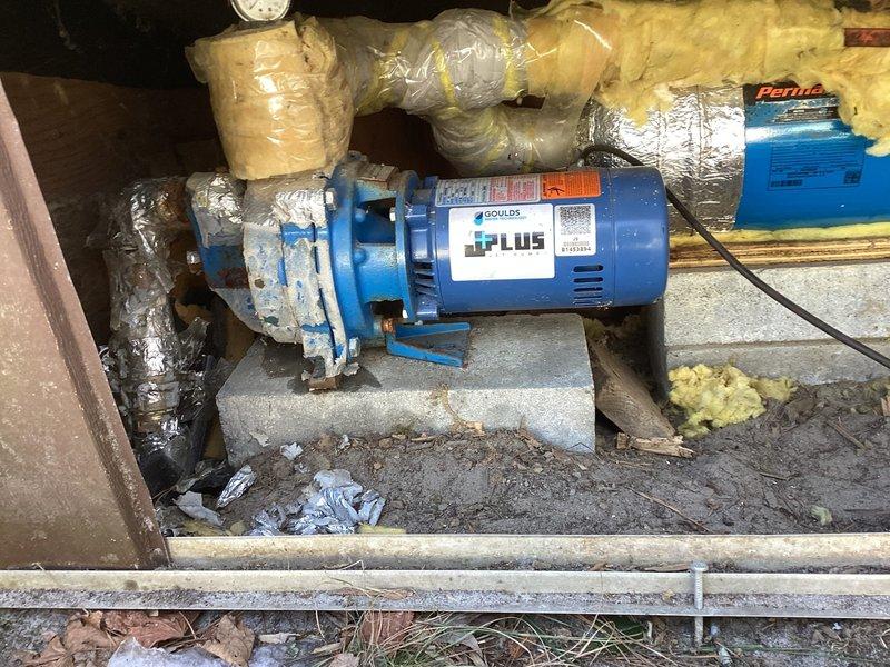 Responded to customer call regarding no water pressure. Diagnosed pump motor assembly that was stuck in closed position. Replaced the faulty Goulds water pump assembly with a new unit, restoring normal water pressure to the home. System now functioning properly with the J-PLUS pump correctly installed on the concrete block base.